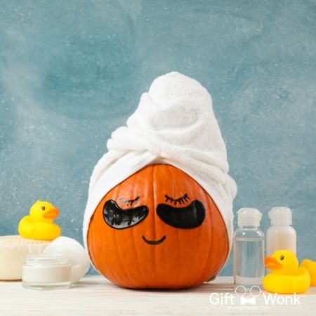 A pumpkin all pampered up with a towel on